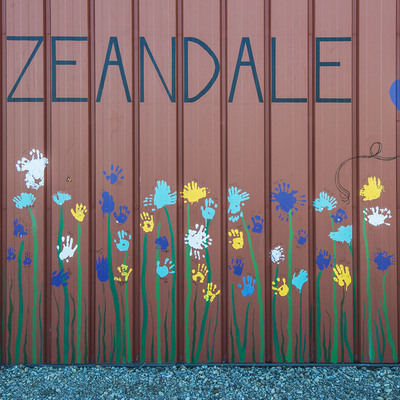 Zeandale sign and flowers/balloons/bees on north side